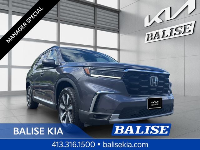 2023 Honda Pilot Touring in Gray — front three-quarter view