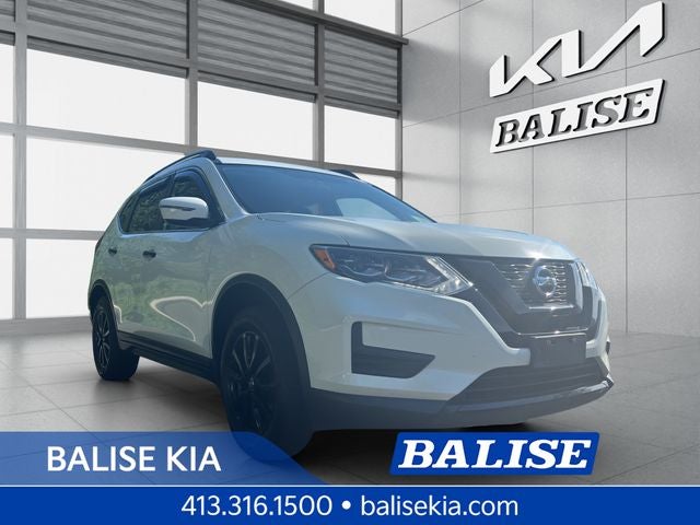 2017 Nissan Rogue SV in Glacier White — front three-quarter view