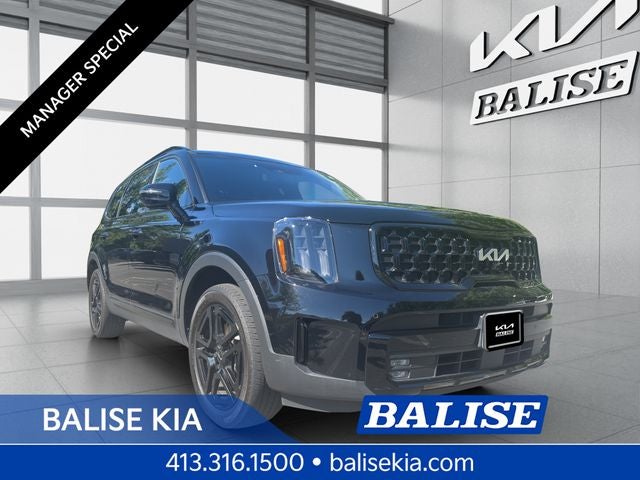 2024 Kia Telluride SX-Prestige X-Line in Ebony Black — front three-quarter view