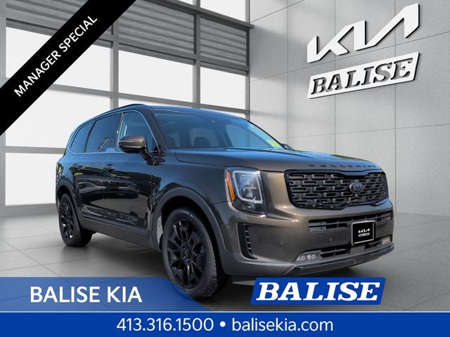 2021 Kia Telluride SX in Dark Moss — front three-quarter view