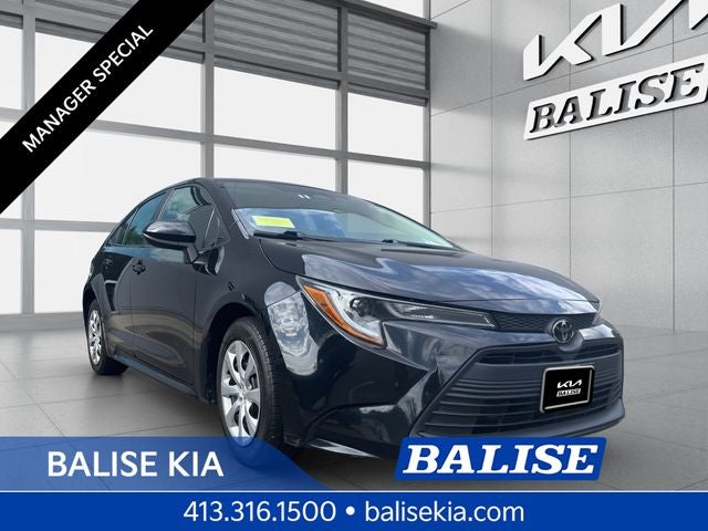 2023 Toyota Corolla LE in Midnight Black Metallic — front three-quarter view