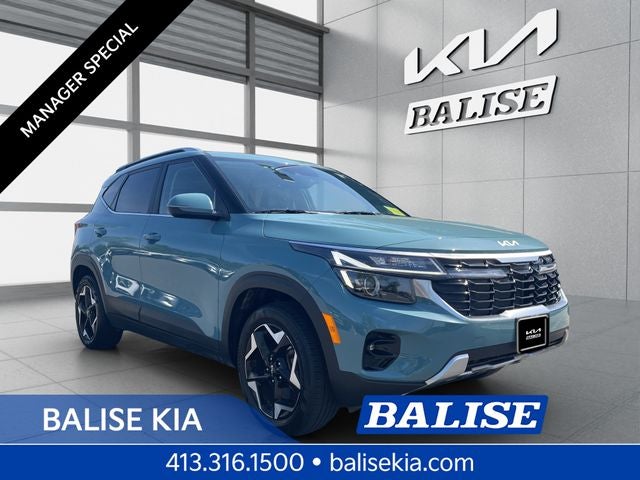 2024 Kia Seltos EX in Pluton Blue — front three-quarter view